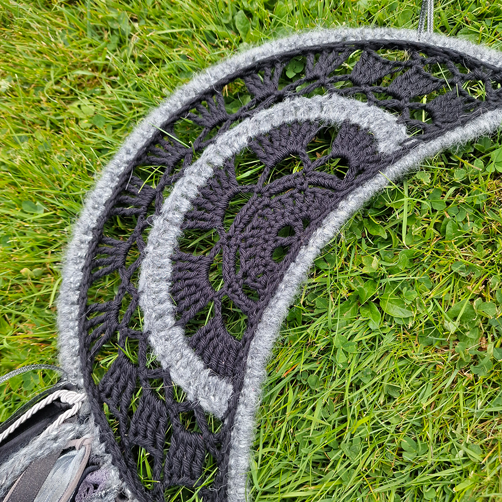 Handmade crochet Moon dreamcatcher with black and silver/grey fringe, perfect for boho wall décor and nursery spaces.