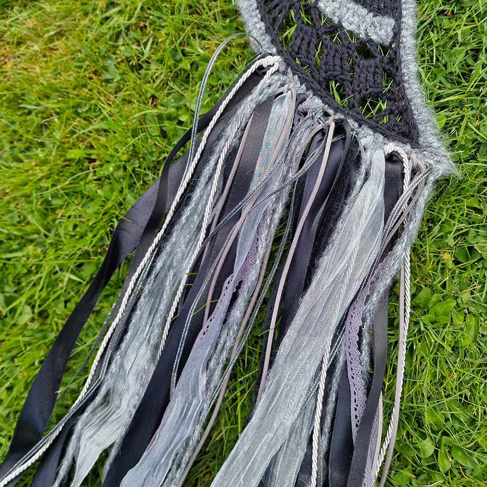 Handmade crochet Moon dreamcatcher with black and silver/grey fringe, perfect for boho wall décor and nursery spaces.