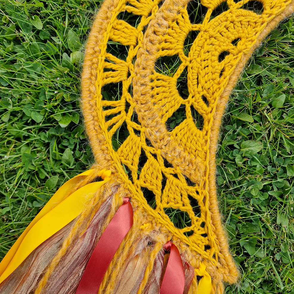 Handmade crochet Moon dreamcatcher with yellow and burnt orange and fringe, perfect for boho wall décor and nursery spaces.