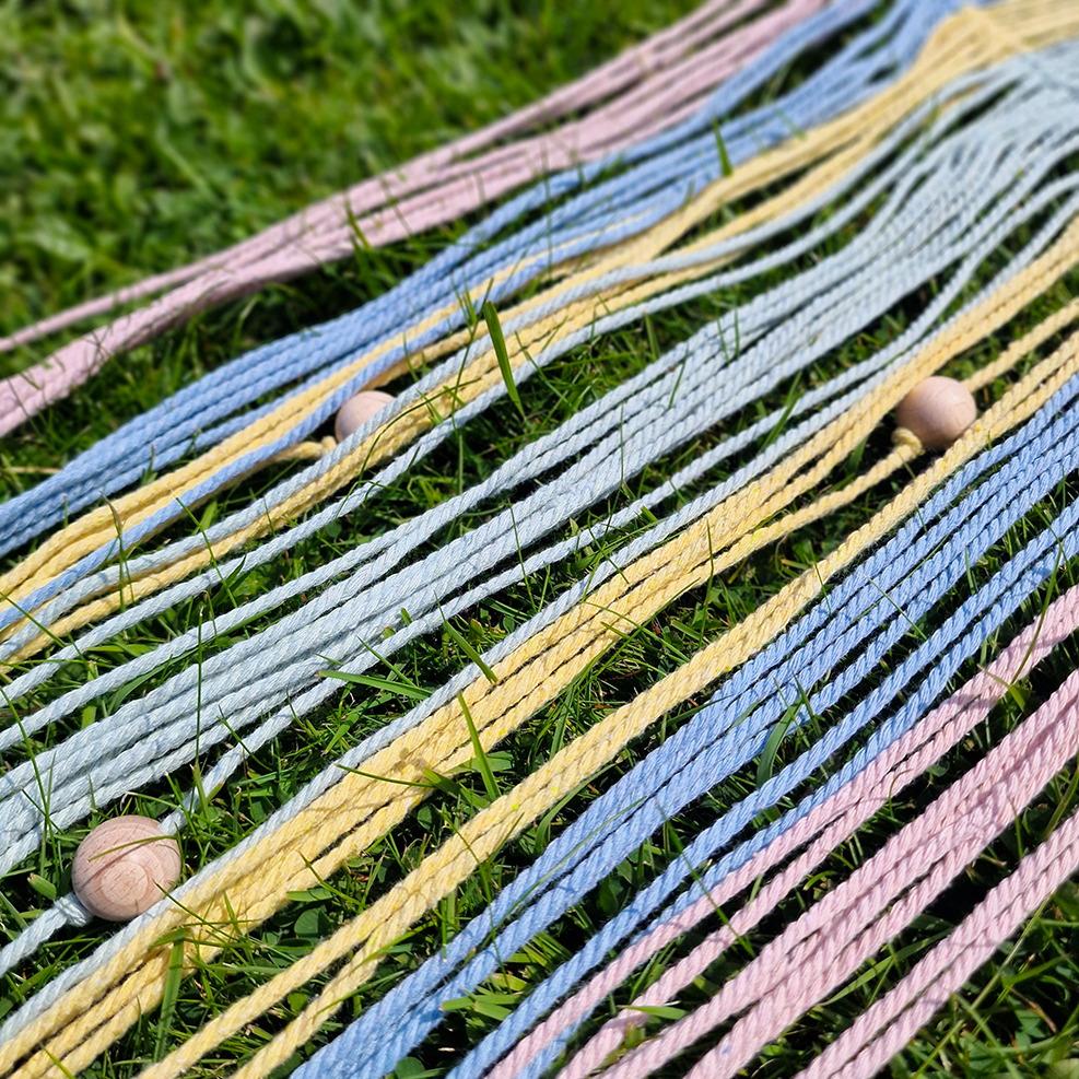 Handcrafted geometric macramé wall hanging in Pastel colours (Pink, blue, yellow and green with beads for boho décor