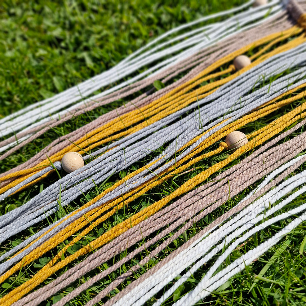 Handcrafted geometric macramé wall hanging in Neutral colours (Grey, Yellow, Beige and Cream) with beads for boho décor