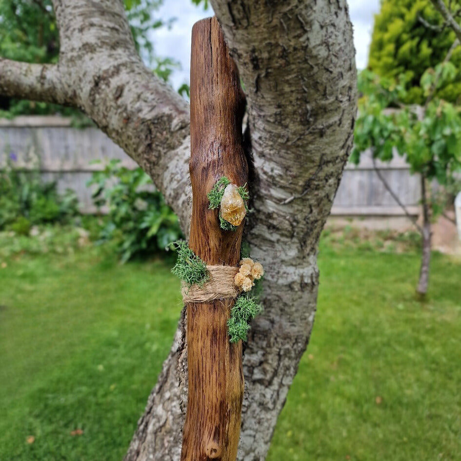 Rustic handmade Pagan witch’s broom with Citrine crystal in the handle, adorned with dried flowers, eucalyptus, and natural twigs.
