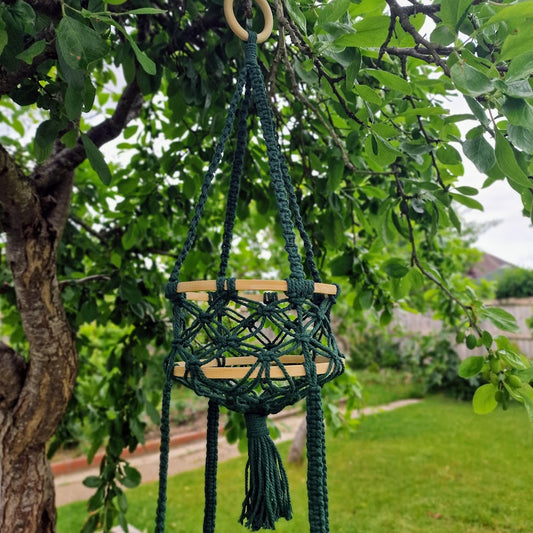 Triple-layered macramé plant hanger or vegetable holder made from natural cotton rope for boho home décor