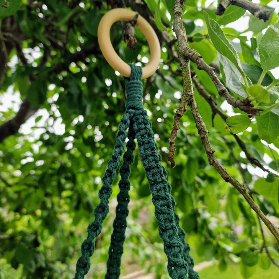 Triple-layered macramé plant hanger or vegetable holder made from natural cotton rope for boho home décor