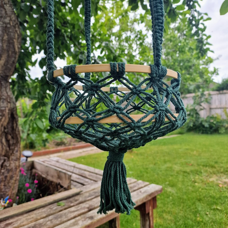 Triple-layered macramé plant hanger or vegetable holder made from natural cotton rope for boho home décor