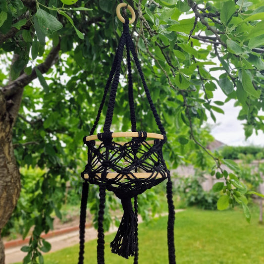 Triple-layered macramé plant hanger or vegetable holder made from natural cotton rope for boho home décor