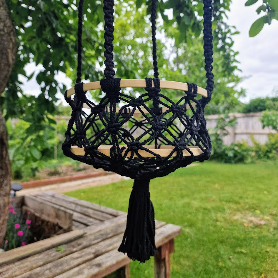 Triple-layered macramé plant hanger or vegetable holder made from natural cotton rope for boho home décor