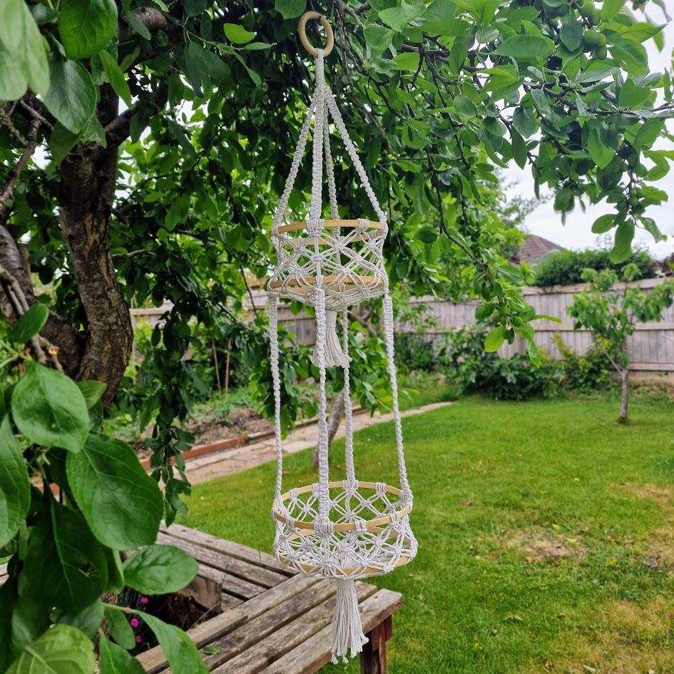 Triple-layered macramé plant hanger or vegetable holder made from natural cotton rope for boho home décor