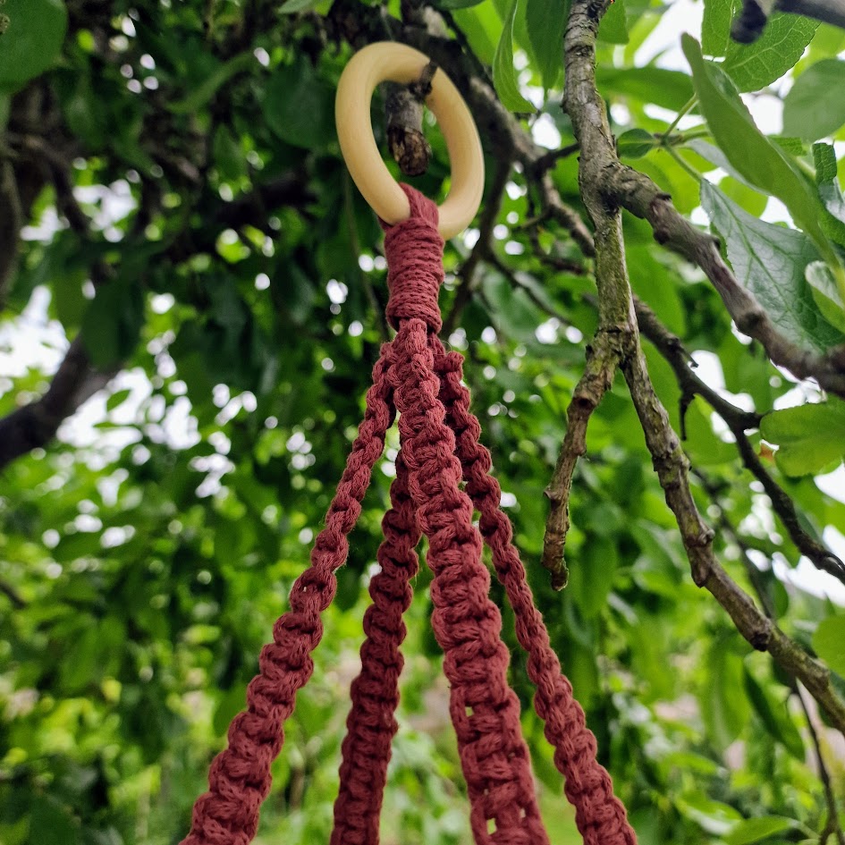 Triple-layered macramé plant hanger or vegetable holder made from natural cotton rope for boho home décor