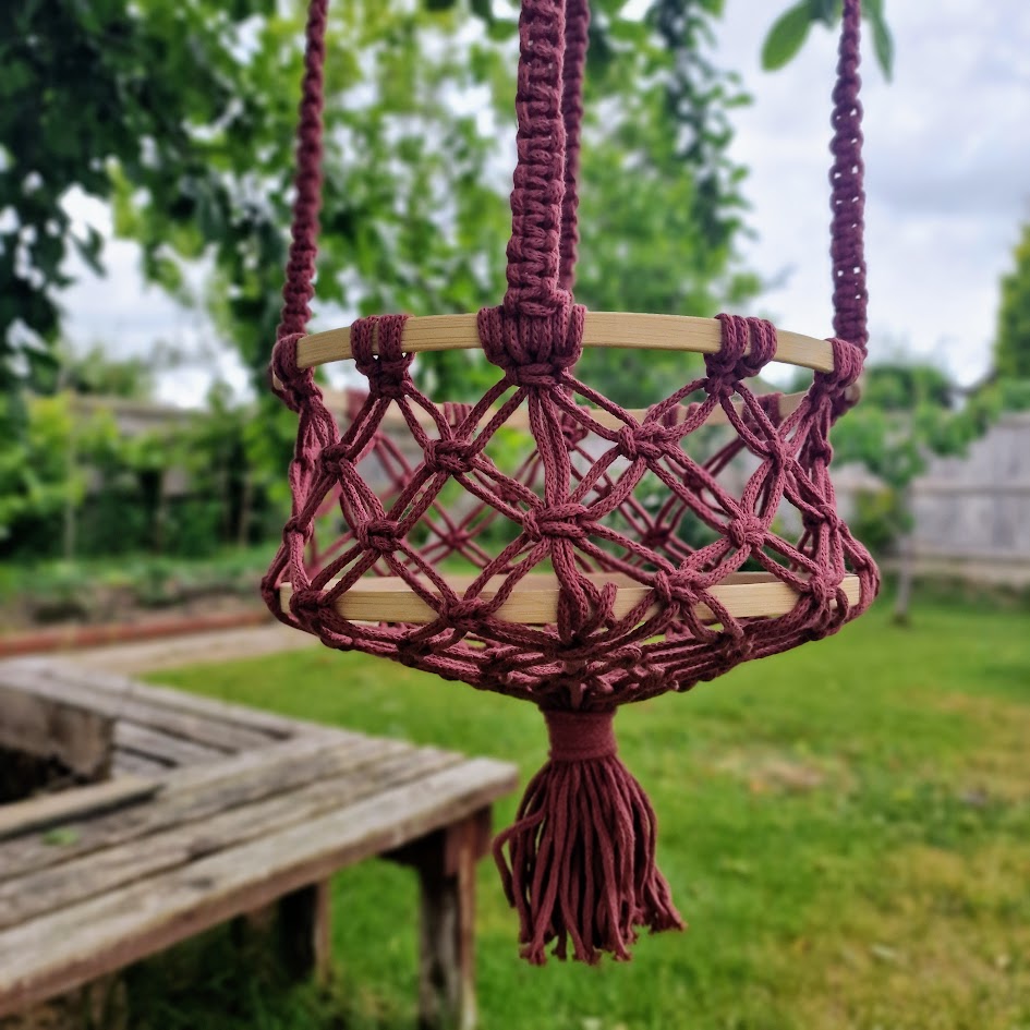 Triple-layered macramé plant hanger or vegetable holder made from natural cotton rope for boho home décor