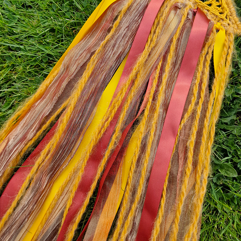 Handmade crochet Moon dreamcatcher with yellow and burnt orange and fringe, perfect for boho wall décor and nursery spaces.