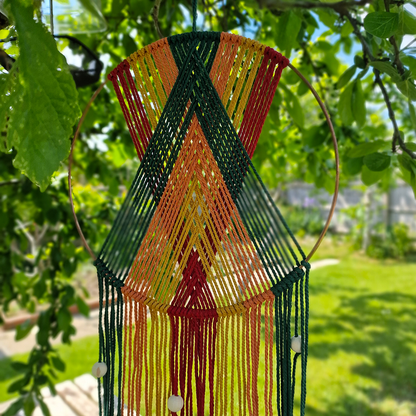Handcrafted geometric macramé wall hanging in Autumnal colours (Red, Yellow, Orange and Green) with beads for boho décor