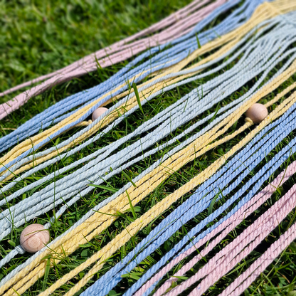 Handcrafted geometric macramé wall hanging in Pastel colours (Pink, blue, yellow and green with beads for boho décor