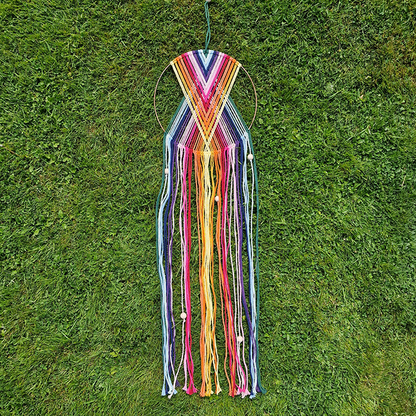 Handcrafted geometric macramé wall hanging in rainbow colours (Red, Yellow, Orange and Green) with beads for boho décor  