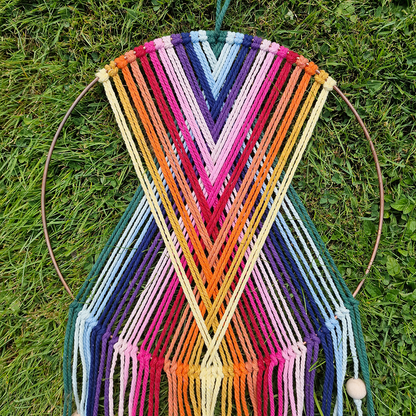 Handcrafted geometric macramé wall hanging in rainbow colours (Red, Yellow, Orange and Green) with beads for boho décor  