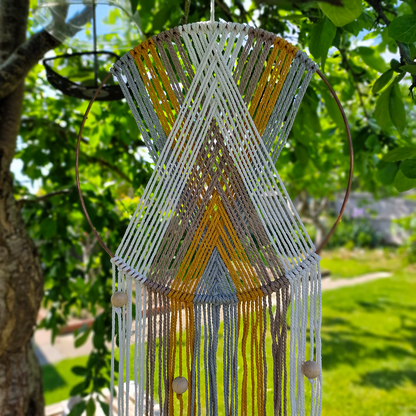 Handcrafted geometric macramé wall hanging in Neutral colours (Grey, Yellow, Beige and Cream) with beads for boho décor