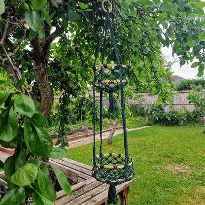 Triple-layered macramé plant hanger or vegetable holder made from natural cotton rope for boho home décor