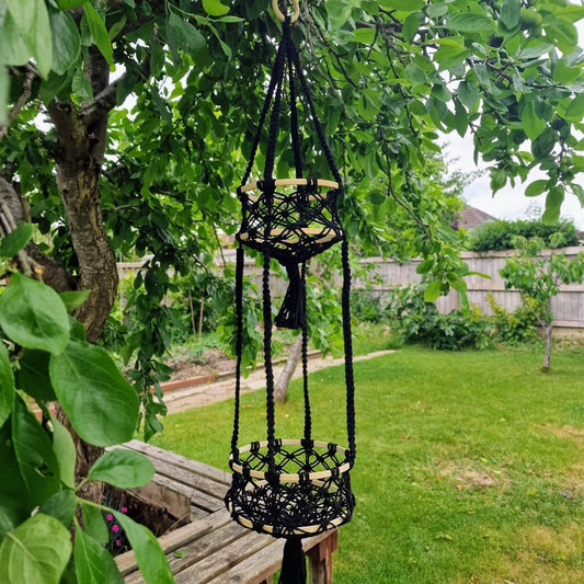 Triple-layered macramé plant hanger or vegetable holder made from natural cotton rope for boho home décor