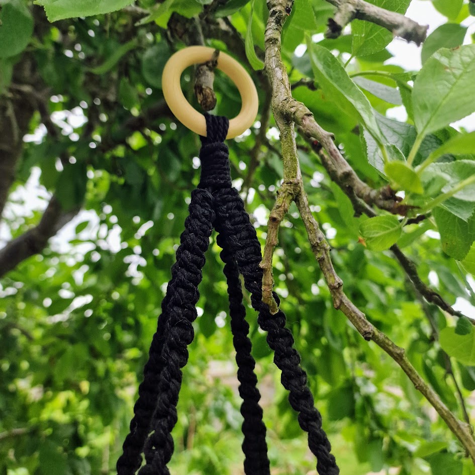 Triple-layered macramé plant hanger or vegetable holder made from natural cotton rope for boho home décor