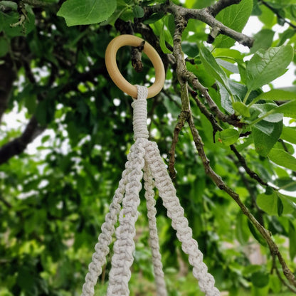 Triple-layered macramé plant hanger or vegetable holder made from natural cotton rope for boho home décor
