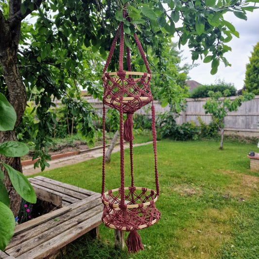 Triple-layered macramé plant hanger or vegetable holder made from natural cotton rope for boho home décor