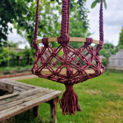 Triple-layered macramé plant hanger or vegetable holder made from natural cotton rope for boho home décor